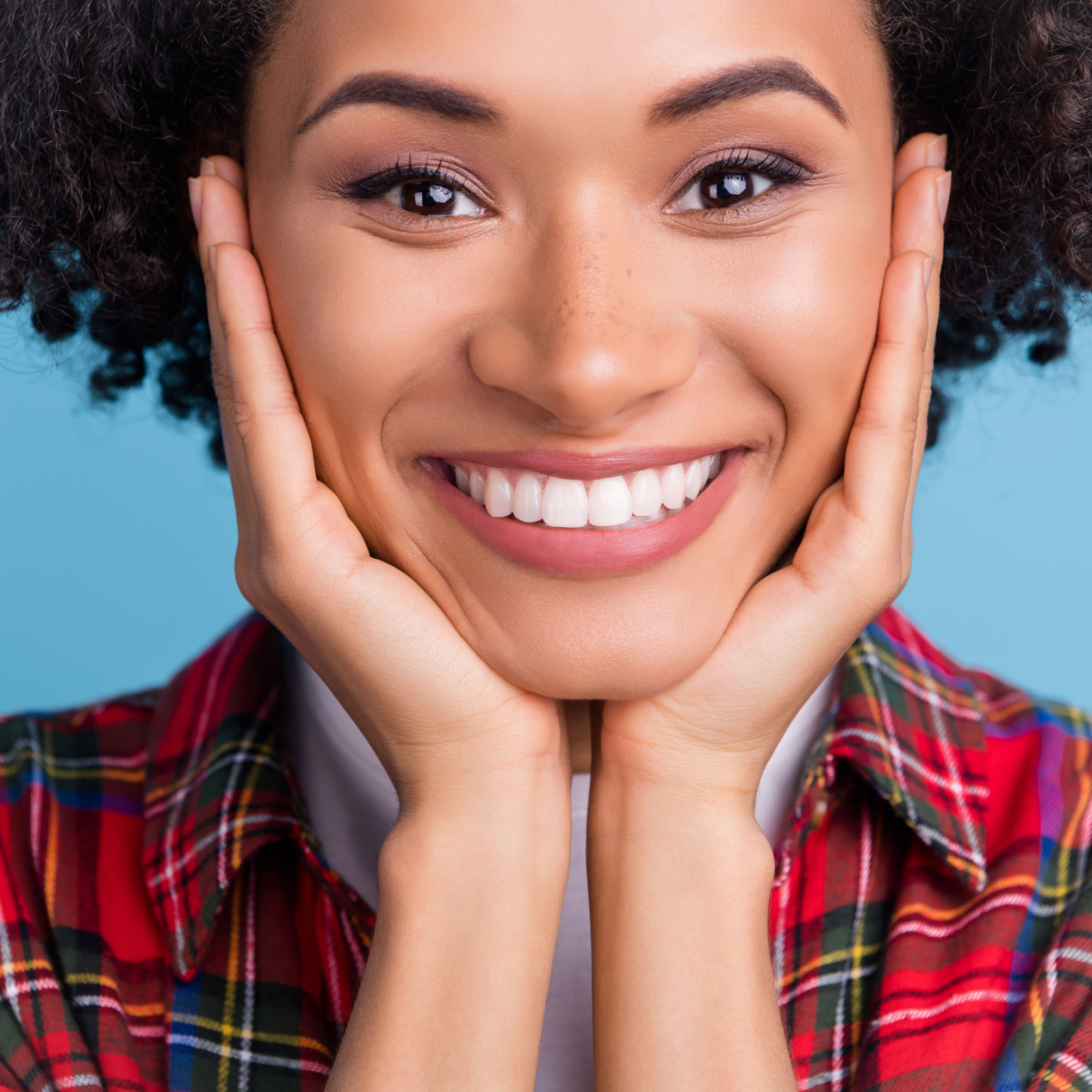 close-up of a woman with a big smile
