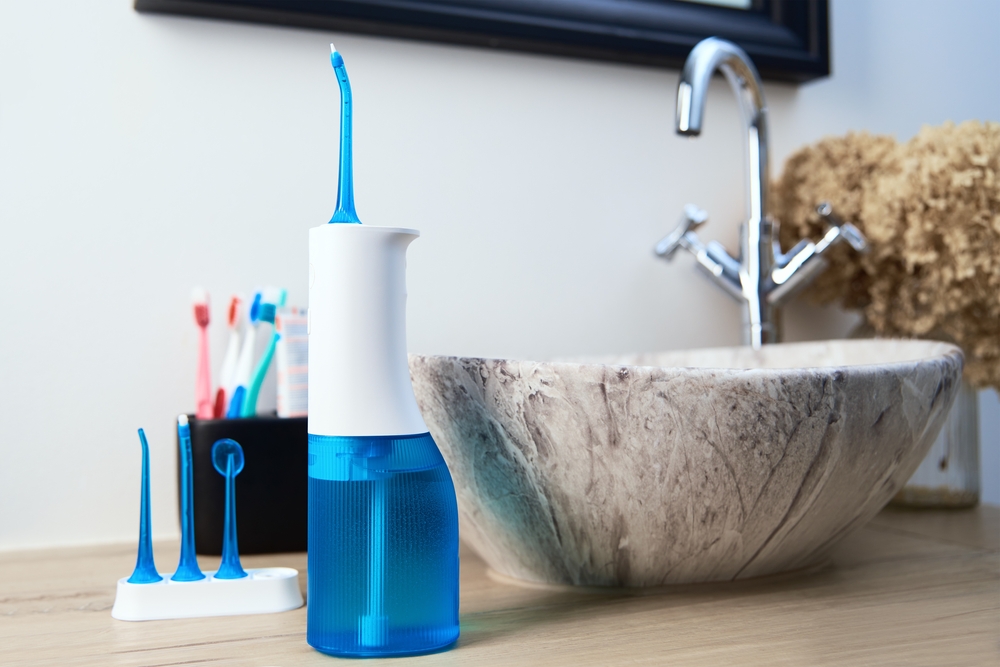 water flosser next to sink